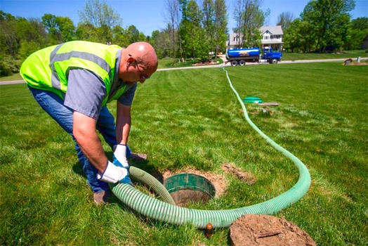 Man working on septic tank issues